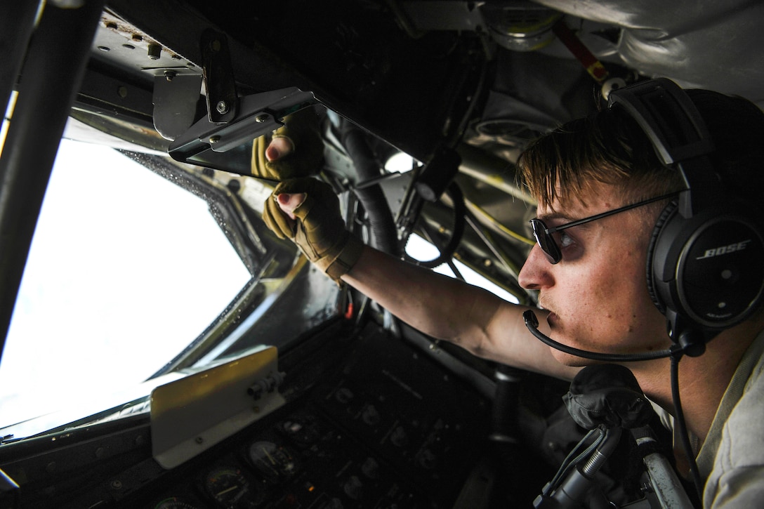 An Air Force airman looks to refuel an A-10 Thunderbolt II over Afghanistan.