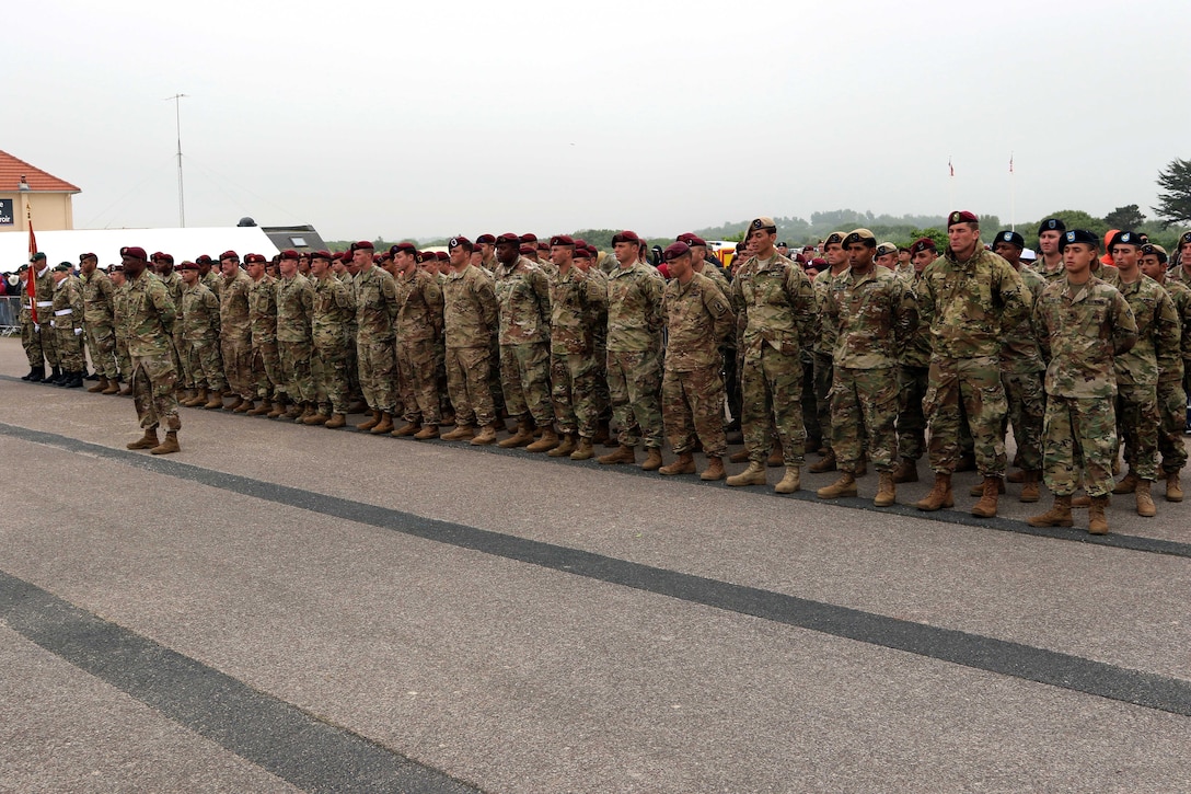 U.S. soldiers stand in formation during the 74th D-Day commemoration ceremony.