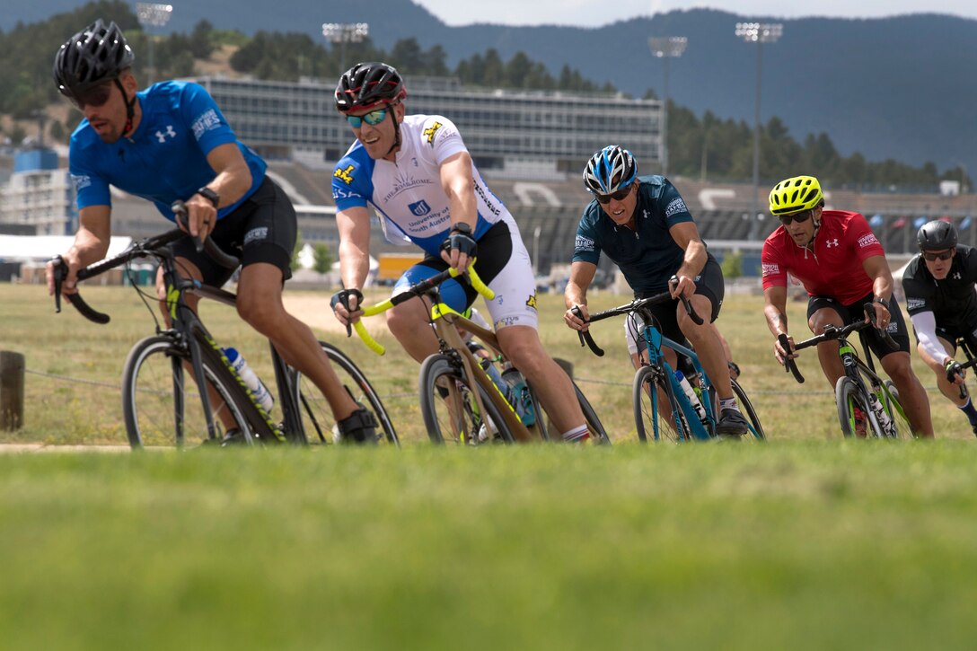 Cyclists race along the course during the 2018 Department of Defense Warrior Games.