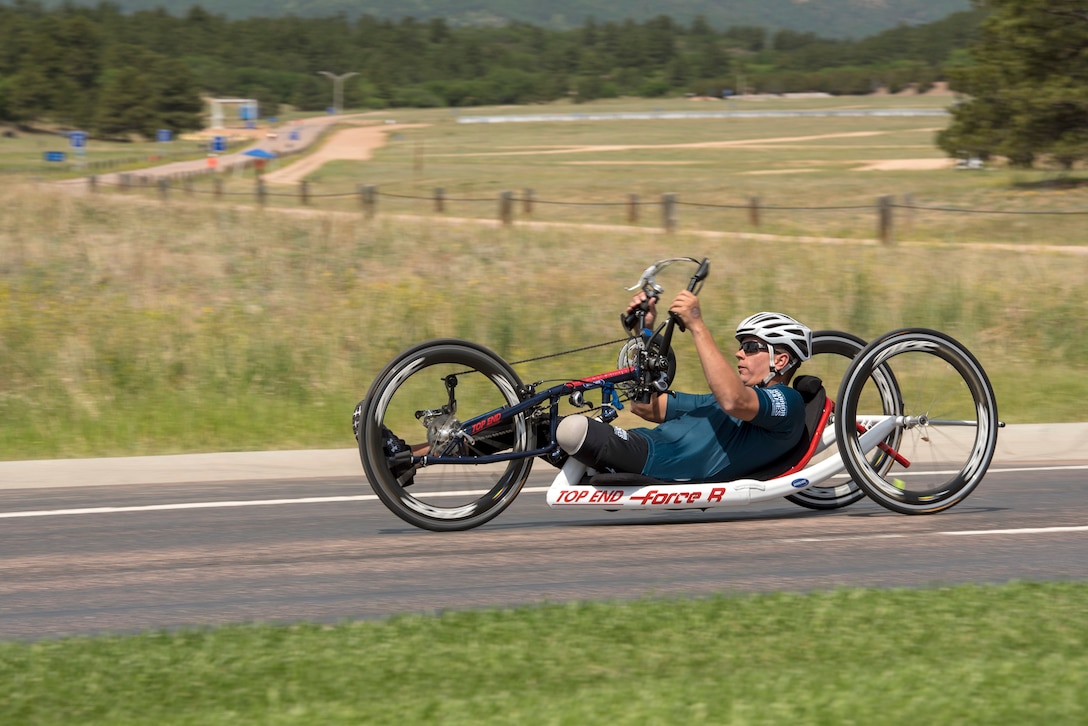 A sailor competes in a cycling event during the Warrior Games.