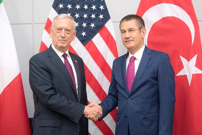 Defense Secretary James N. Mattis shakes hands with the Turkish defense minister.