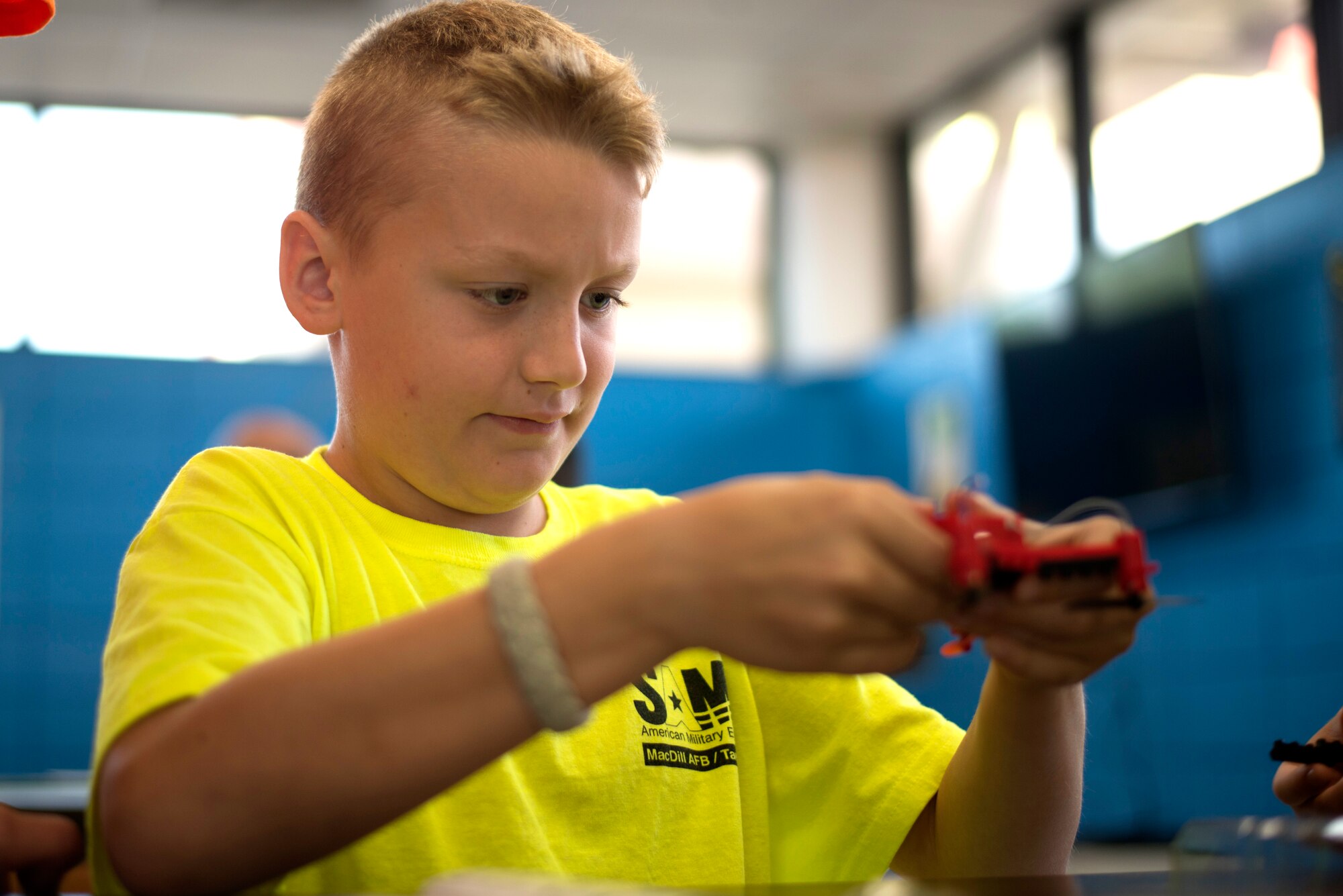 A child puts a drone together at MacDill Air Force Base, Fla., during a Science Technology Engineering and Math camp June 5, 2018.