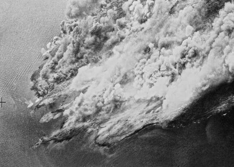 Billowing smoke covers bomb-blasted Mediterranean island of Pantelleria, Italy, where the Allies dropped 6,202 tons of bombs for more than a month in 1943. (National Archives)
