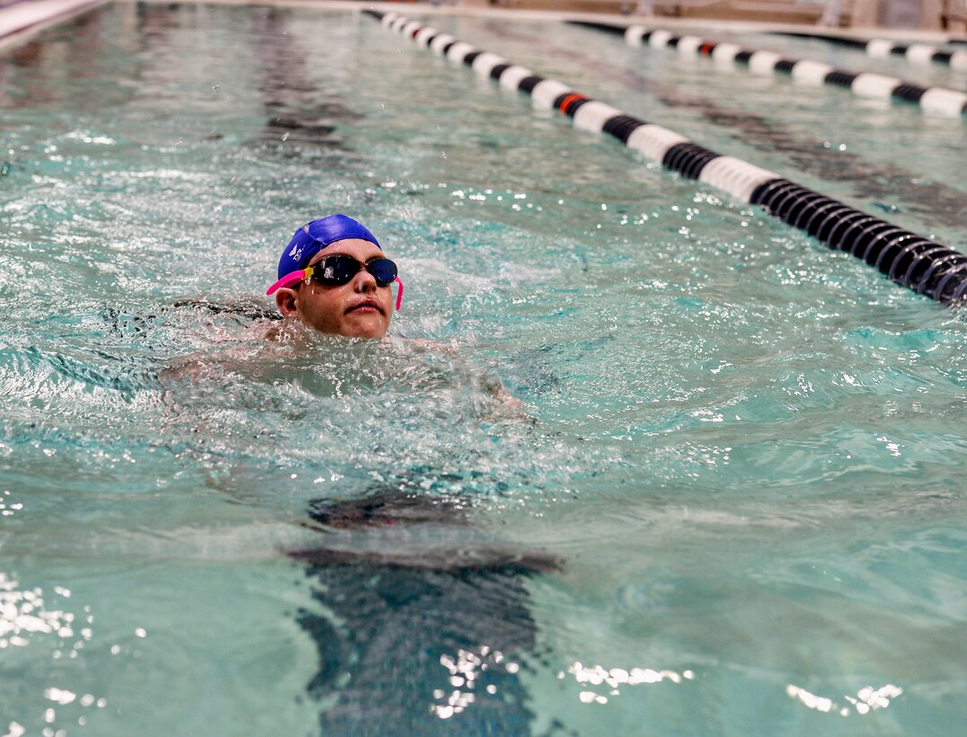 Simon Cole, younger brother of command post controller Staff Sgt. Beverly C. Meijers, 157th Air Refueling Wing, swims the 25 meter event during the Summer 2018 N.H. Special Olympics on June 1, 2018 at the University of New Hampshire Swasey Pool in Durham, N.H. Cole competed in three swimming events. (N.H. Air National Guard photo by Staff Sgt. Kayla White)