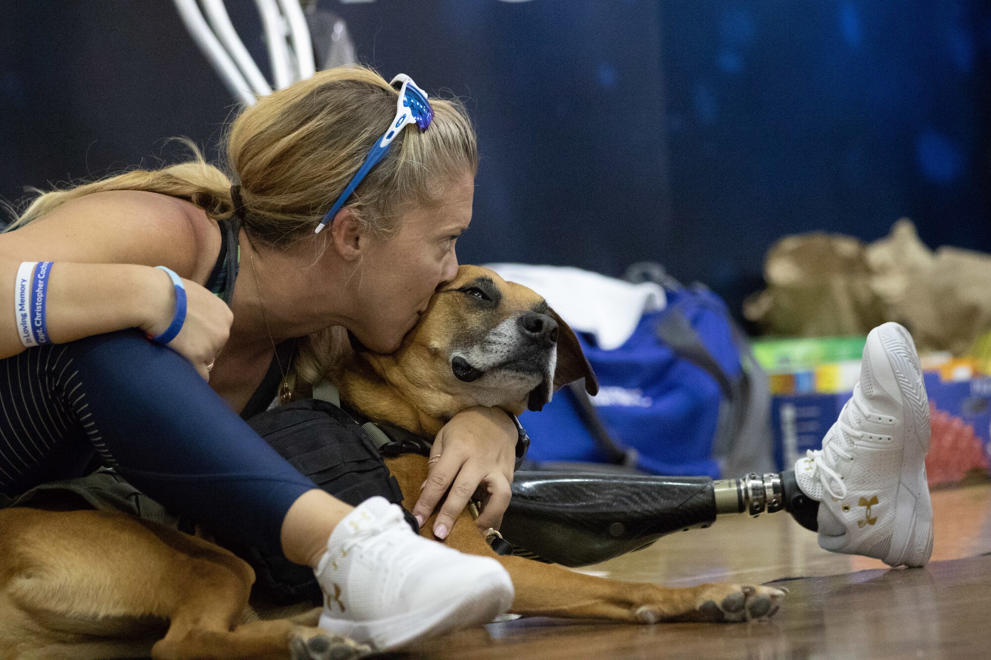 Retired Senior Airman Heather Carter takes a break with service dog Rocky after competing in sitting volleyball at the Department of Defense Warrior Games 2018.  Warrior Games is a Paralympic style competition where wounded warriors compete in 11 different adaptive sporting events. Competition this year started June 1 and runs through June 9.  (U.S. Air Force photo by Master Sergeant David Long)