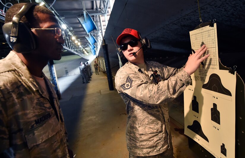 Staff Sgt. Brandon Howard, 628th Security Forces Squadron Combat Arms Training and Maintenance instructor, trains an M-4 rifle course student during a qualifying course June 5, 2018, at Joint Base Charleston, S.C. CATM instructors at Joint Base Charleston support all military branches and are responsible for qualifying service members and civilians on various weapons.