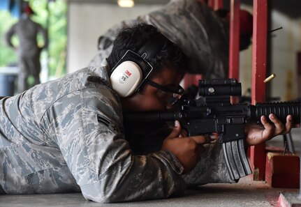 Airman 1st Class Isaiah Wynn, 628th Logistics Readiness Squadron, fires an M-4 rifle during a qualifying course facilitated by 628th Security Forces Squadron Combat Arms Training and Maintenance instructors June 5, 2018, at Joint Base Charleston, S.C. CATM instructors at Joint Base Charleston support all military branches and are responsible for qualifying service members and civilians on various weapons.