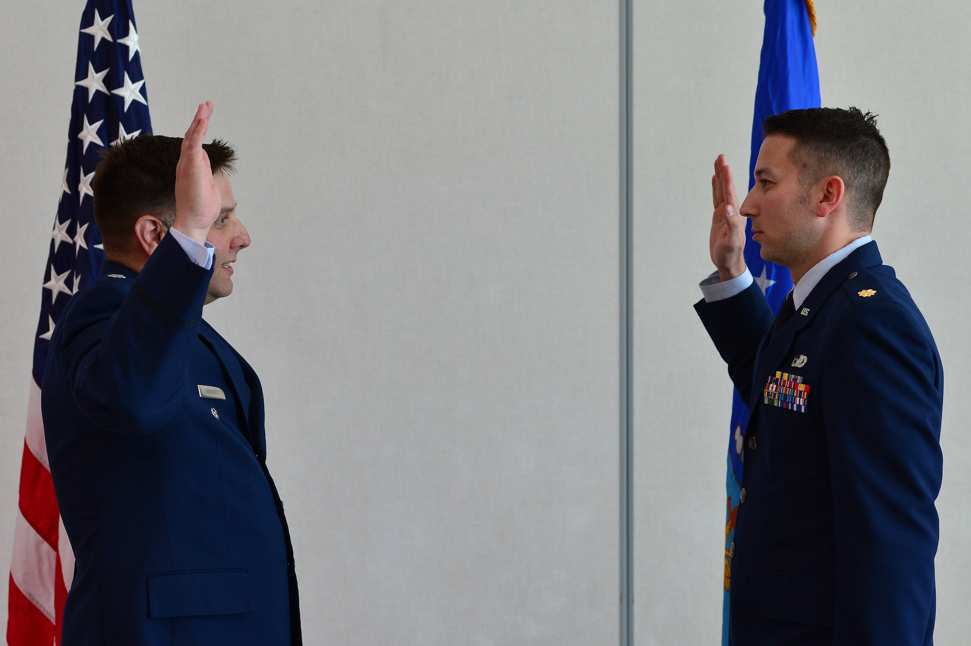 Maj. Phillip, 732nd Operations Group chief of intelligence, recites his oath of office during his promotion ceremony March 31, 2018, in Las Vegas. Though he is a third generation Airman, Phillip is the first generation officer in his family. (U.S. Air Force photo by Airman 1st Class Haley Stevens)