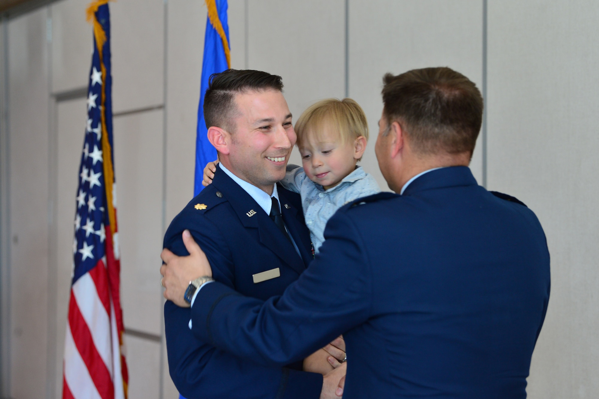 Maj. Phillip, 732nd Operations Group chief of intelligence, thanks Lt. Col. Daniel Finkelstein, presiding officer of Maj. Phillip’s promotion ceremony March 31, 2018, in Las Vegas. Phillip expressed his family’s excitement for their continued growth and the opportunity to lead future Airmen. (U.S. Air Force photo by Airman 1st Class Haley Stevens)