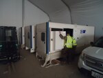Engineers from the host installation and DLA Disposition Services Installation Operations inspect generators before they are put into service to electrify large area maintenance shelters.