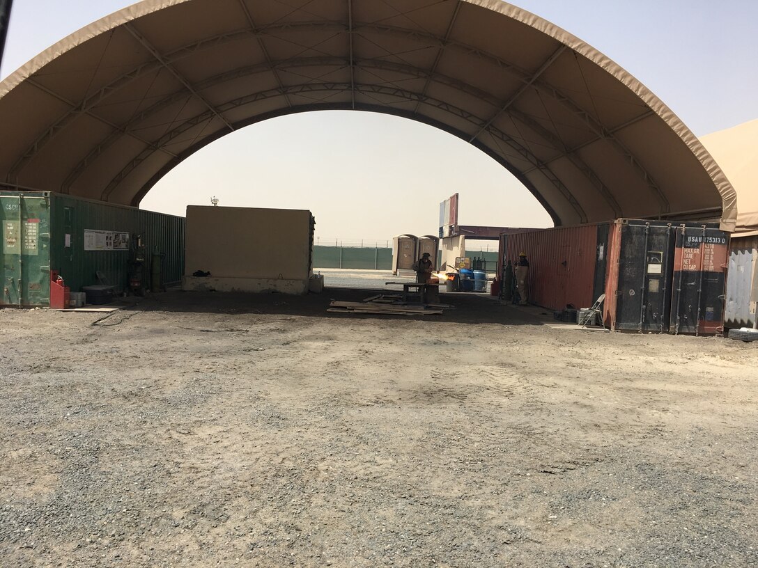 Visitors from DLA Installation Operations observe daily operations like demilitarization to help determine if the agency employees have the enough space and the proper facilities to support their work.