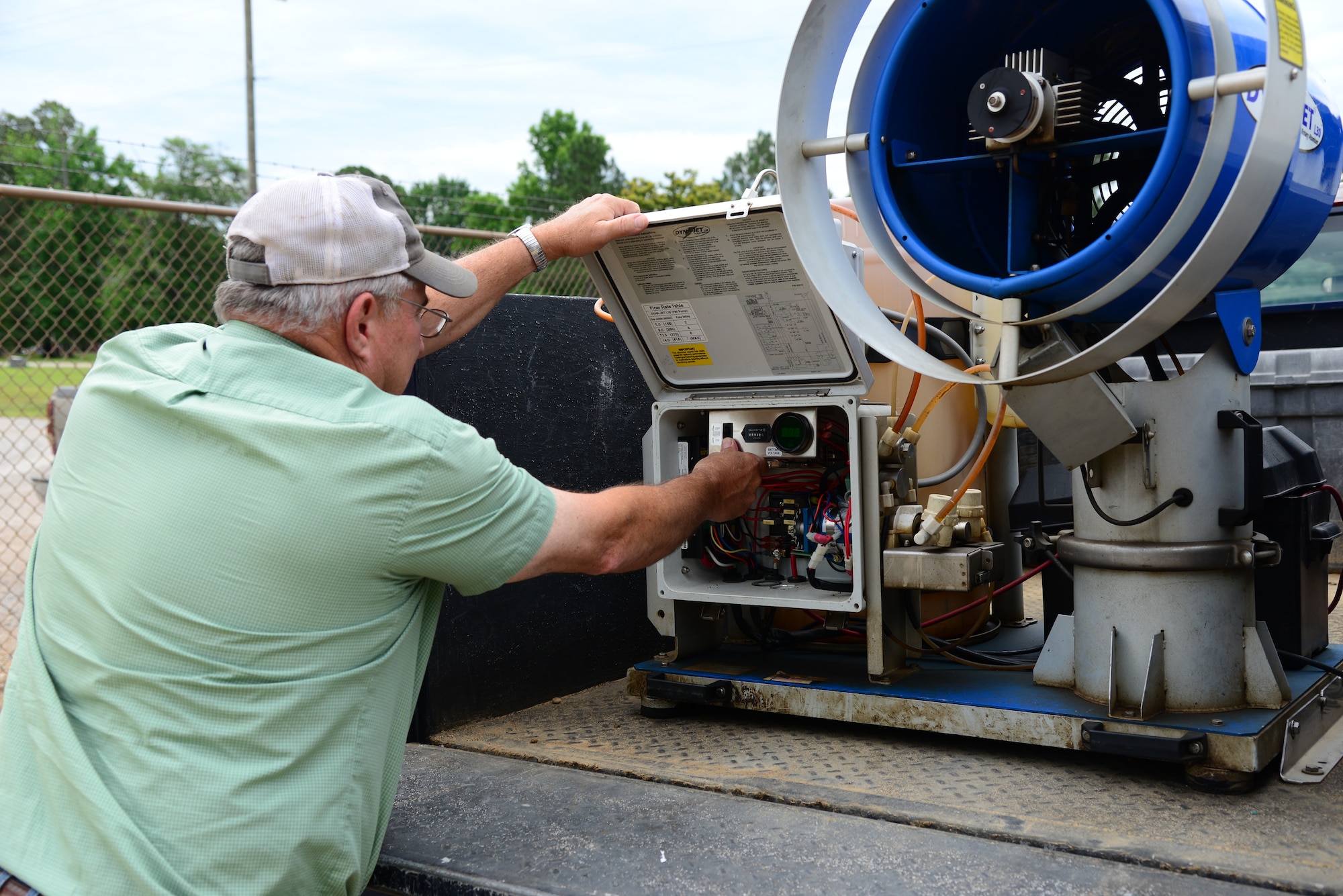 Robert Miller, 14th Civil Engineer Squadron pest controller, prepares a fogging machine June 5, 2018, on Columbus Air Force Base, Mississippi. The pest controllers fill the fogger with U.S. Environmental Protection Agency-approved pesticides and drive around the base to control the mosquito population. (U.S. Air Force photo by Airman 1st Class Beaux Hebert)