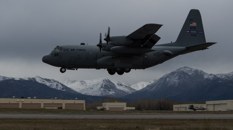 A C-130 Hercules approaches the flightline for landing at Joint Base Elmendorf-Richardson, Alaska, May 10, 2018. The C-130 can accommodate a wide variety of oversized cargo, including utility helicopters and six-wheeled armored vehicles to standard palletized cargo and passengers. In an aerial delivery role, it can airdrop loads up to 42,000 pounds or use its high-flotation landing gear to land and deliver cargo on rough, dirt strips.