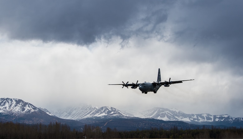 A C-130 Hercules approaches the flightline for landing at Joint Base Elmendorf-Richardson, Alaska, May 10, 2018. The C-130 can accommodate a wide variety of oversized cargo, including utility helicopters and six-wheeled armored vehicles to standard palletized cargo and passengers. In an aerial delivery role, it can airdrop loads up to 42,000 pounds or use its high-flotation landing gear to land and deliver cargo on rough, dirt strips.