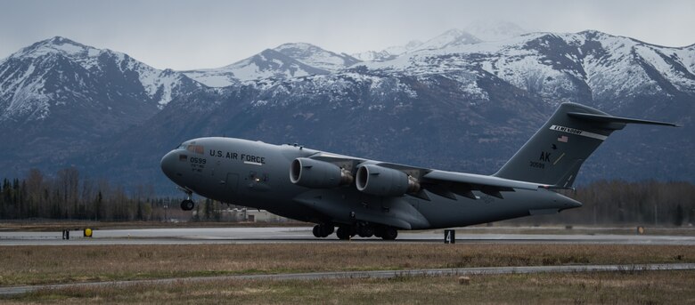 An Alaska Air National Guard C-17 Globemaster III assigned to the 176th Wing takes off from Joint Base Elmendorf-Richardson, Alaska, May 10, 2018. The C-17 Globemaster III is the newest, most flexible cargo aircraft to enter the airlift force. It’s capable of rapid strategic delivery of troops and all types of cargo to main operating bases or directly to forward bases in the deployment area.