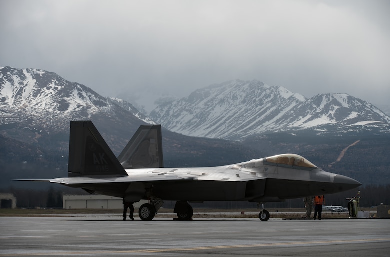 An F-22 Raptor refuels at Joint Base Elmendorf-Richardson, Alaska, May 10, 2018. The F-22’s combination of stealth, supercruise, maneuverability, and integrated avionics, coupled with improved supportability, represents an exponential leap in warfighting capabilities. The Raptor performs both air-to-air and air-to-ground missions allowing full realization of operational concepts vital to the 21st century Air Force.