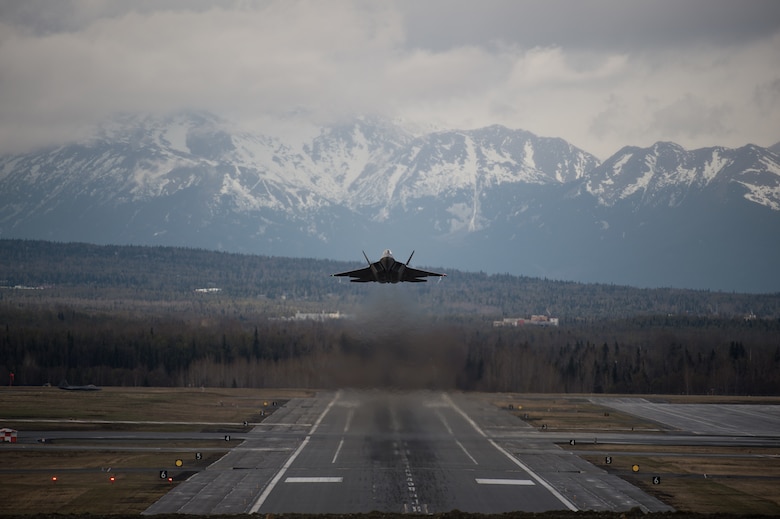 An F-22 Raptor takes flight at Joint Base Elmendorf-Richardson, Alaska, May 10, 2018. The F-22, a critical component of the Global Strike Task Force, is designed to project air dominance rapidly and at great distances and defeat threats to the U.S. and its allies. The F-22 cannot be matched by any known or projected fighter aircraft.
