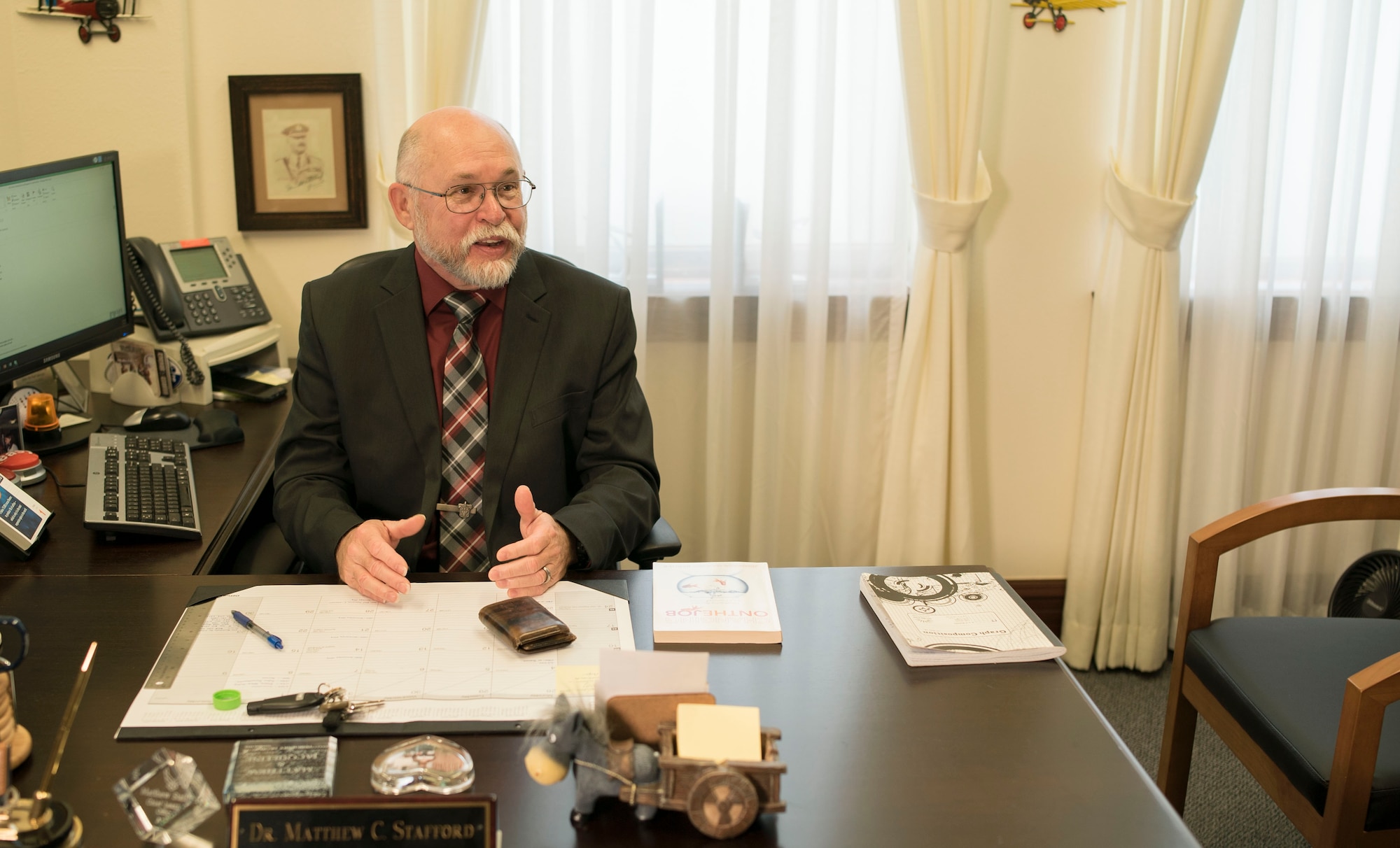 Dr. Matthew Stafford discusses the Continuum of Learning with a visitor at Air Education and Training Command headquarters, Joint Base San Antonio-Randolph, Texas, June 1, 2018.  Stafford, appointed as AETC Chief Learning Officer on May 23, 2018, is the first person to hold the position in approximately seven years. (U.S. Air Force photo by Alex Goad)