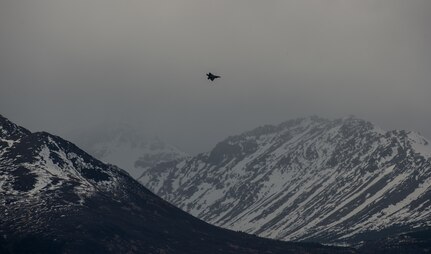 An F-22 Raptor soars over the Chugach Mountains near Joint Base Elmendorf-Richardson, Alaska, May 10, 2018. The F-22’s combination of stealth, supercruise, maneuverability, and integrated avionics, coupled with improved supportability, represents an exponential leap in warfighting capabilities. The Raptor performs both air-to-air and air-to-ground missions allowing full realization of operational concepts vital to the 21st century Air Force.