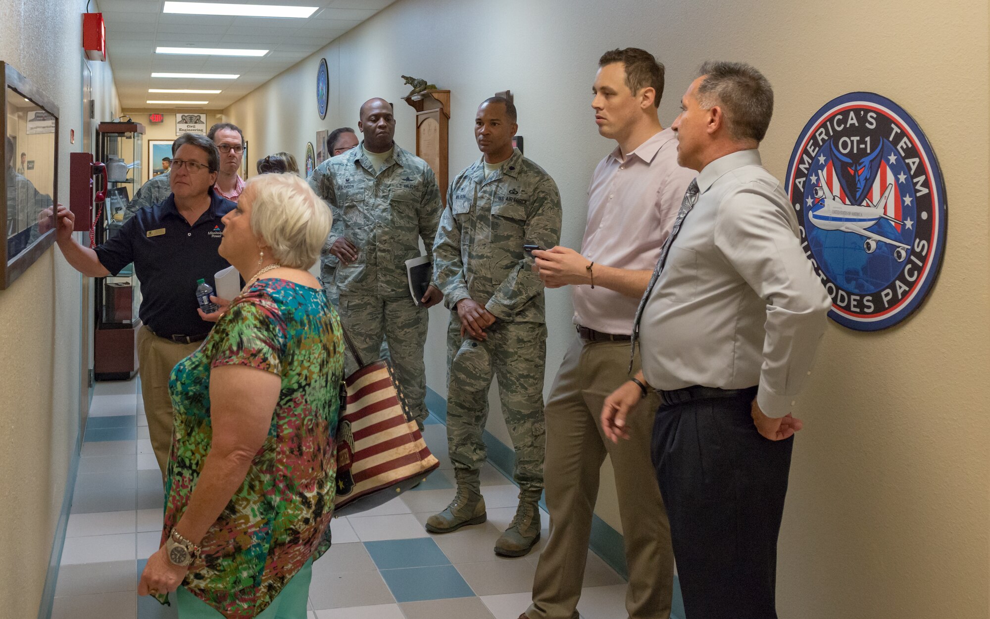 Local community leaders admire World War II memorabilia at Cody Hall during an 81st Training Group Honorary Commanders' tour on Keesler Air Force Base, Mississippi, June 7, 2018. The purpose of the tour is to better educate the honorary commanders on the 81st TRG mission and capabilities. (U.S. Air Force photo by Andre Askew)