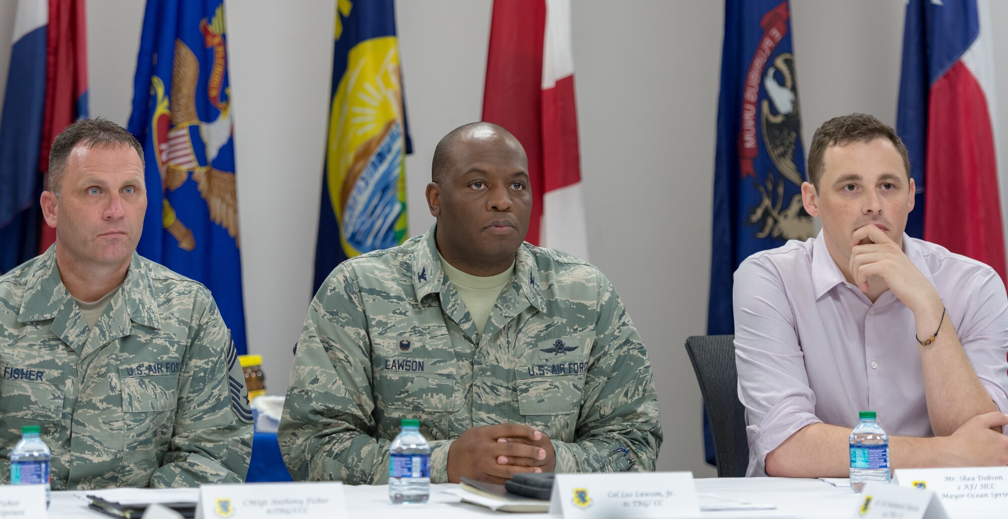 U.S. Air Force Chief Master Sgt. Anthony Fisher, 81st Training Group superintendent, Col. Leo Lawson Jr., 81st TRG commander, and Shea Dobson, Ocean Springs Mayor, attend the 81st TRG mission briefing during an 81st TRG Honorary Commanders' tour at the Levitow Training Support Facility on Keesler Air Force Base, Mississippi, June 7, 2018. The tour also included briefings at the 334th Training Squadron air traffic control tower simulator and the 81st Training Support Squadron Trainer Development Center. (U.S. Air Force photo by Andre Askew)