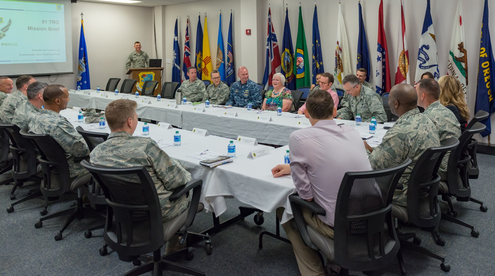 Local community leaders attend the 81st Training Group mission briefing during an 81st TRG Honorary Commanders' tour at the Levitow Training Support Facility on Keesler Air Force Base, Mississippi, June 7, 2018. The tour also included briefings at the 334th Training Squadron air traffic control tower simulator and the 81st Training Support Squadron Trainer Development Center. (U.S. Air Force photo by Andre Askew)