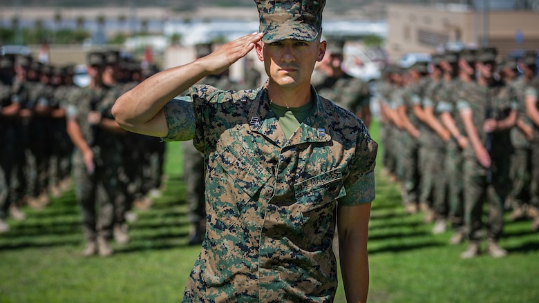 Capt. Colin Elsasser, assistant operations officer, 1st Battalion, 7th Marine Regiment salutes the colors during the unit’s change of command ceremony aboard the Marine Corps Air Ground Combat Center, Twentynine Palms, Calif., June 4, 2018. The change of command ceremony ensures that the unit and its Marines are never without official leadership, and also signifies an allegiance of Marines to their unit’s commander. (U.S. Marine Corps photo by Lance Cpl. Rachel K. Porter)