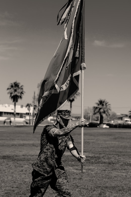 Sgt. Maj. Brian E. Anderson, sergeant major, 1st Battalion, 7th Marine Regiment, carries the battalion colors during the unit’s change of command ceremony aboard the Marine Corps Air Ground Combat Center, Twentynine Palms, Calif., June 4, 2018. The change of command ceremony ensures that the unit and its Marines are never without official leadership, and also signifies an allegiance of Marines to their unit’s commander. (U.S. Marine Corps photo by Lance Cpl. Rachel K. Porter)