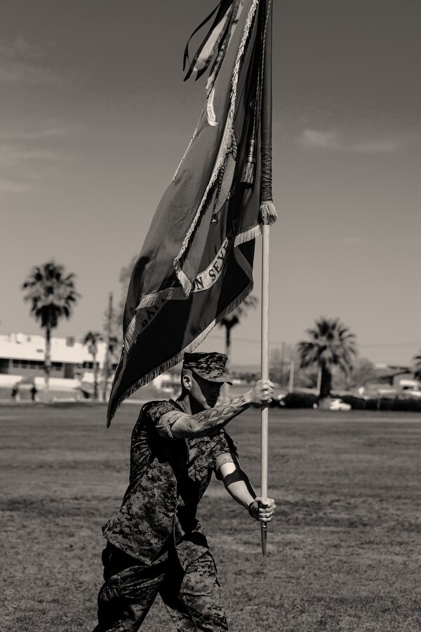 Sgt. Maj. Brian E. Anderson, sergeant major, 1st Battalion, 7th Marine Regiment, carries the battalion colors during the unit’s change of command ceremony aboard the Marine Corps Air Ground Combat Center, Twentynine Palms, Calif., June 4, 2018. The change of command ceremony ensures that the unit and its Marines are never without official leadership, and also signifies an allegiance of Marines to their unit’s commander. (U.S. Marine Corps photo by Lance Cpl. Rachel K. Porter)