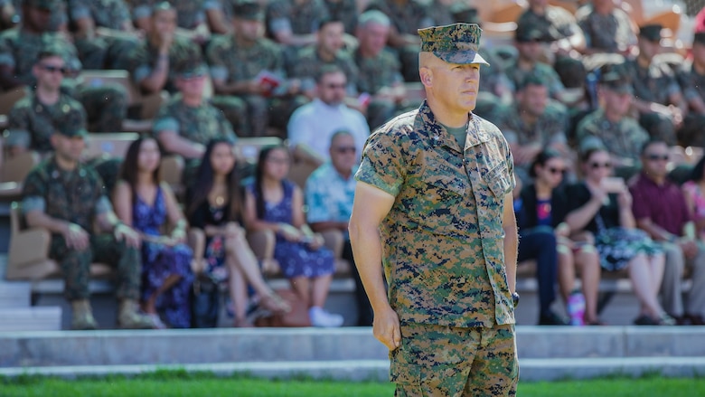 Lt. Col. Erick T. Clark, off-going commanding officer, 1st Battalion, 7th Marine Regiment, stands in the reviewing box during the change of command ceremony of 1st Battalion, 7th Marine Regiment aboard the Marine Corps Air Ground Combat Center, Twentynine Palms, Calif., June 4, 2018. The change of command ceremony ensures that the unit and its Marines are never without official leadership, and also signifies an allegiance of Marines to their unit’s commander. (U.S. Marine Corps photo by Lance Cpl. Rachel K. Porter)