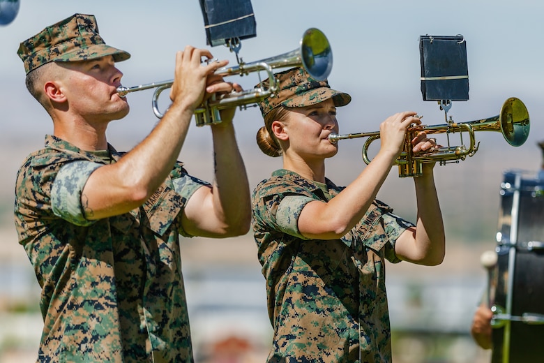 Marines with the 1st Marine Division band perform during 1st Battalion, 7th Marine Regiment’s change of command ceremony aboard the Marine Corps Air Ground Combat Center, Twentynine Palms, Calif., June 4, 2018. The change of command ceremony ensures that the unit and its Marines are never without official leadership, and also signifies an allegiance of Marines to their unit’s commander. (U.S. Marine Corps photo by Lance Cpl. Rachel K. Porter)