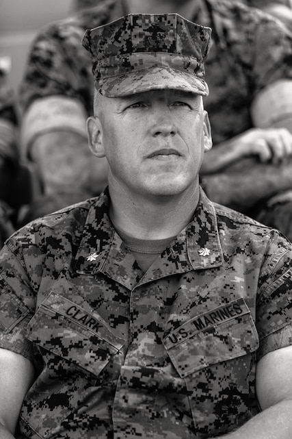 Lt. Col. Erick T. Clark, off-going commanding officer, 1st Battalion, 7th Marine Regiment, sits at the change of command ceremony for 1/7 aboard the Marine Corps Air Ground Combat Center, Twentynine Palms, Calif., June 4, 2018. 7th Marines where he relinquishes his command aboard the Marine Corps Air Ground Combat Center, Twentynine Palms, Calif., June 4, 2018. The change of command ceremony ensures that the unit and its Marines are never without official leadership, and also signifies an allegiance of Marines to their unit’s commander. (U.S. Marine Corps photo by Lance Cpl. Rachel K. Porter)