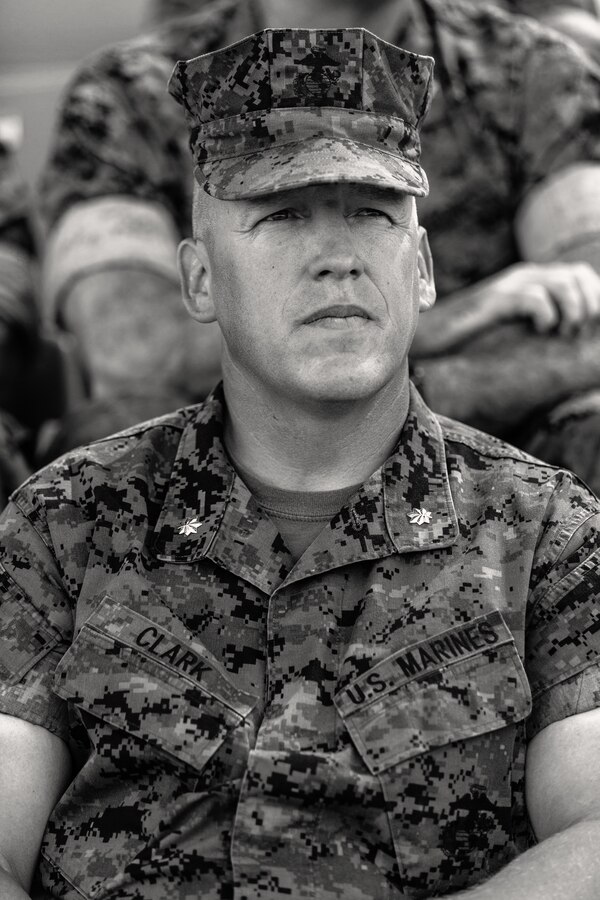 Lt. Col. Erick T. Clark, off-going commanding officer, 1st Battalion, 7th Marine Regiment, sits at the change of command ceremony for 1/7 aboard the Marine Corps Air Ground Combat Center, Twentynine Palms, Calif., June 4, 2018. 7th Marines where he relinquishes his command aboard the Marine Corps Air Ground Combat Center, Twentynine Palms, Calif., June 4, 2018. The change of command ceremony ensures that the unit and its Marines are never without official leadership, and also signifies an allegiance of Marines to their unit’s commander. (U.S. Marine Corps photo by Lance Cpl. Rachel K. Porter)