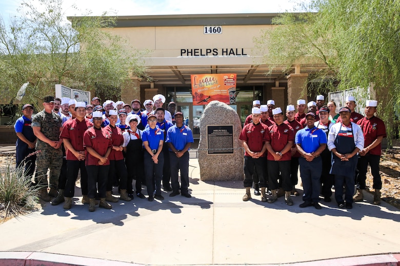 Food service Marines and Sedexo employees await the grand re-opening of Phelps Mess Hall aboard the Marine Corps Air Ground Combat Center, Twentynine Palms, Calif., June 4, 2018. Phelps Hall has been closed since November 11, 2017, due to renovations to improve the efficiency of the facility. (U.S. Marine Corps photo by Lance Cpl. Margaret Gale)