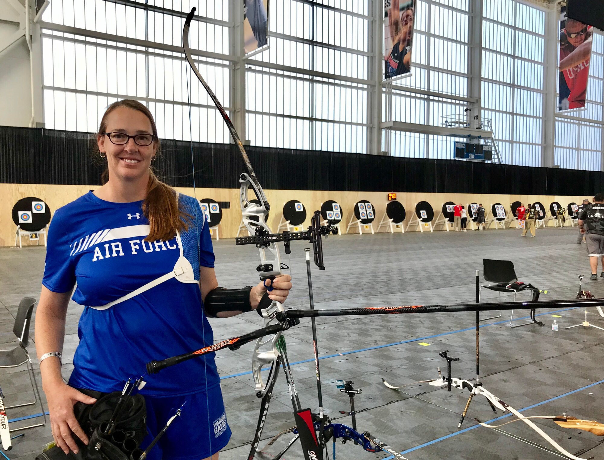 U.S. Air Force retired Lt. Col. Melissa McAvoy strikes a pose with her bow before archery finals at the U.S. Air Force Base Academy in Colorado Springs, Colorado, June 7, 2018. McAvoy was first introduced to the Air Force Wounded Warrior (AFW2) program in 2017, after suffering from complex post-traumatic stress disorder which stemmed from a sexual assault early in her career and was exasperated by the threat of landmines, harassment and multiple assaults incurred while being the only woman (and most of the time the only American) forward deployed in Ethiopia. (U.S. Air Force photo by Alexx Pons)