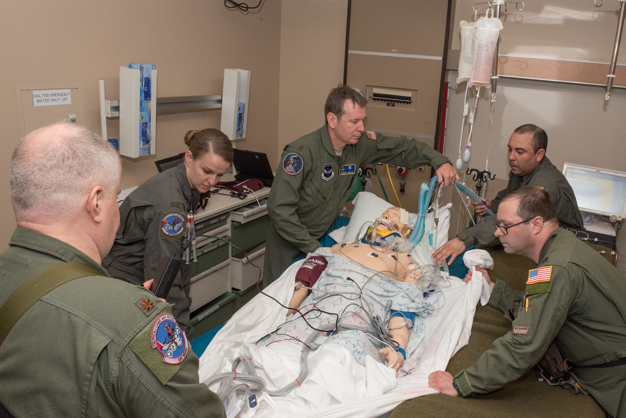 Members of the 109th Airlift Wing, New York Air National Guard, prepare to transfer a patient to a guerney during the Critical Care Air Transport Team training event in Minneapolis, Minn., May 31, 2018. (U.S. Air Force photo by Master Sgt. Eric Amidon)