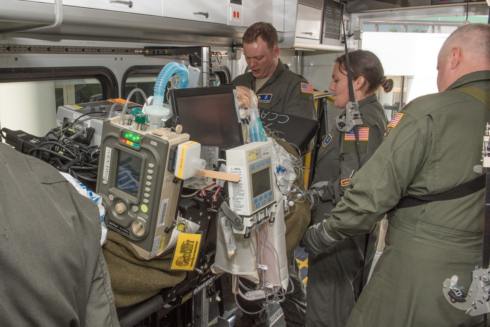 Members of the 109th Airlift Wing, New York Air National Guard, secure and stabilize their patient as they prepare for transportation to the air field during the Critical Care Air Transport Team training event in Minneapolis, Minn., May 31, 2018. (U.S. Air Force photo by Master Sgt. Eric Amidon)