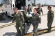 Members of the 109th Airlift Wing, New York Air National Guard, transfer their patient from the transport to the aircraft during the Critical Care Air Transport Team training event at Minneapolis-St. Paul Air Reserve Staion, Minn., May 31, 2018. (U.S. Air Force photo by Master Sgt. Eric Amidon)