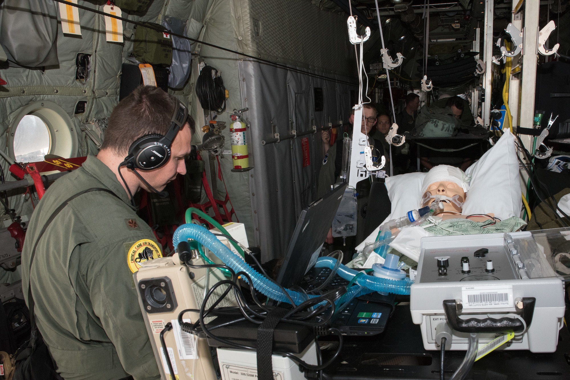 Maj. Philip Goebel, a Critical Care Air Transport Team physician with the 109th Airlift Wing, New York Air National Guard, prepare their patient for transfer to a guerney during the CCATT training event at the Minneapolis-St. Paul Air Reserve Station, Minn., May 31, 2018. (U.S. Air Force photo by Master Sgt. Eric Amidon)