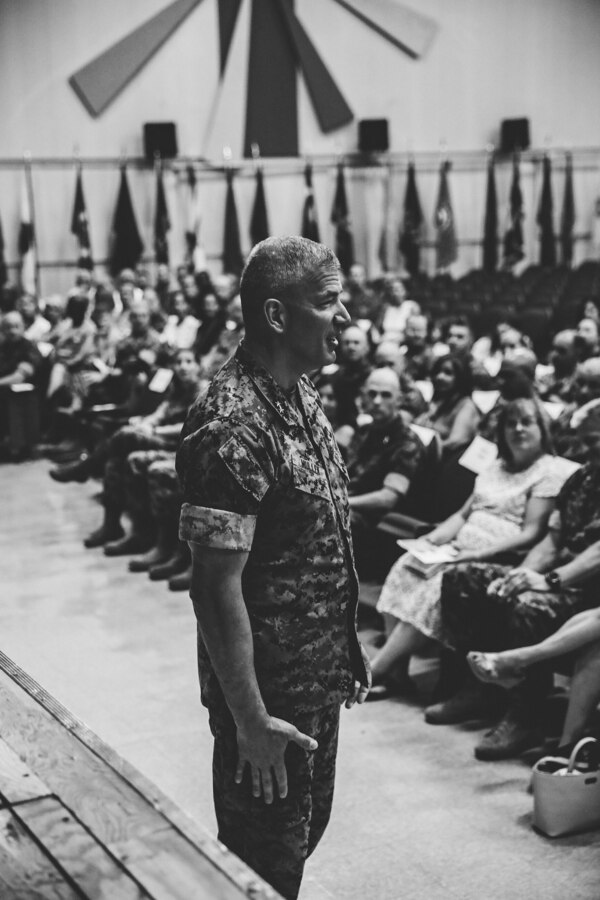 Maj. Gen. William F. Mullen III, off-going commanding general, Marine Corps Air Ground Combat Center, says his goodbyes during the installation's change of command ceremony aboard the Combat Center, Twentynine Palms, Calif., June 8, 2018. The change of command ceremony ensures that the unit and its Marines are never without official leadership, and also signifies an allegiance of Marines to their unit commander. (U.S. Marine Corps photo by Lance Cpl. William Chockey)