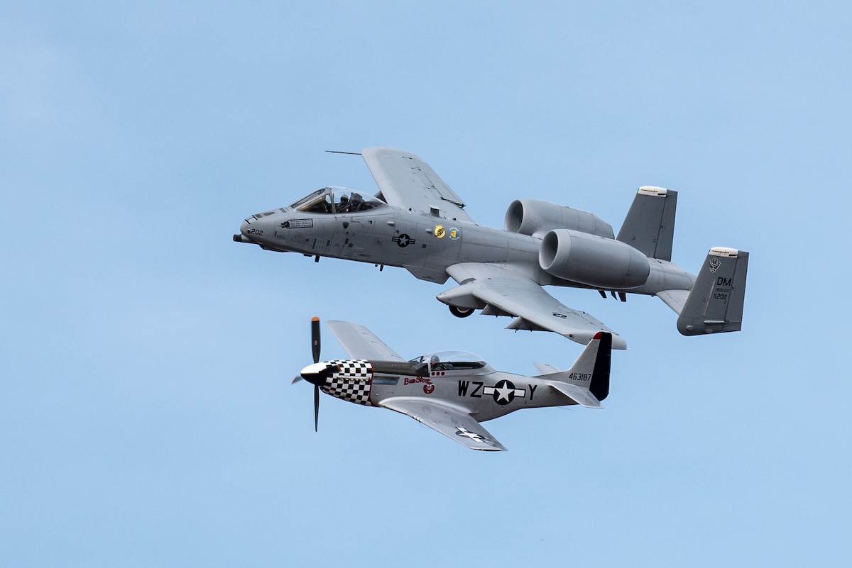 A U.S. Air Force A-10 Thunderbolt II aircraft participates in a heritage flight with a P-51 Mustang during the Thunder Over Louisville air show in Louisville, Ky., April 21, 2018. The Kentucky Air National Guard once again served as the base of operations for military aircraft participating in the show, providing essential maintenance and logistical support. (U.S. Air National Guard photo by Lt. Col. Dale Greer)