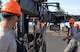 Air Force Combat Munitions competition team members from the 56th Equipment Maintenance Squadron munitions flight setup bomb assembly utilities during a practice run June 6, 2018, at Luke Air Force Base, Ariz. Challenges for the competition include munitions assembly conveyor setup, bomb-building, and inventory inspection. (U.S. Air Force photo by Senior Airman Ridge Shan)