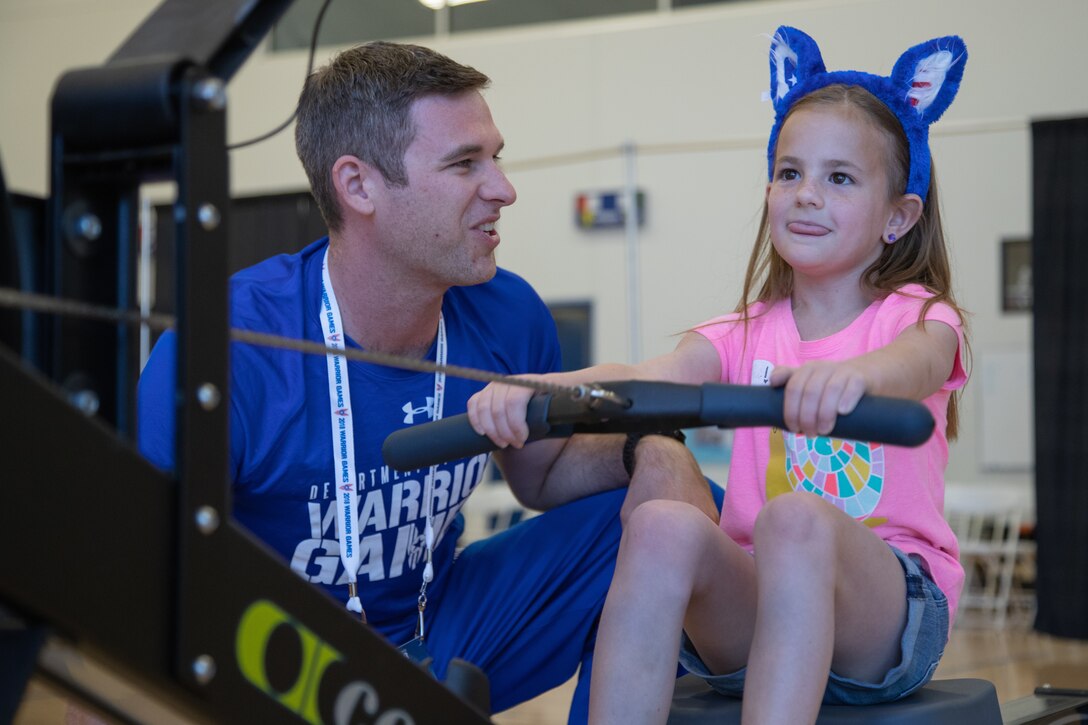 An airman talk with a child.