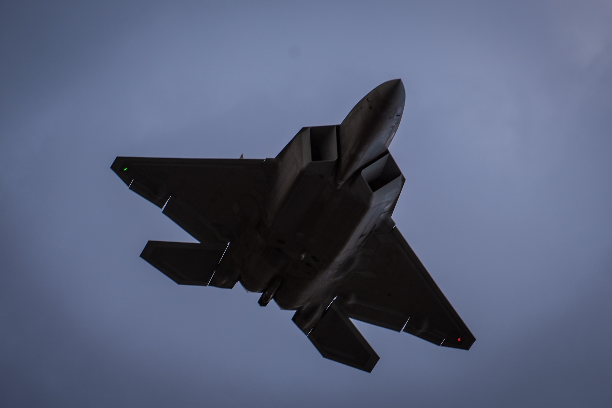An F-22 Raptor soars through the sky above Joint Base Elmendorf-Richardson, Alaska, May 10, 2018. The Air Force announced the temporary relocation of personnel and F-22s from the 95th Fighter Squadron, Tyndall Air Force Base, Florida, to Joint Base (JB) Pearl Harbor-Hickam, Hawaii, and JB Elmendorf-Richardson, Alaska, Nov. 2, 2018. The unit is being relocated as Tyndall begins its long-term recovery following the devastation caused by Hurricane Michael, which struck the base in early October 2018..