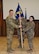 Lt. Col. Tiffany Feet assumes command of the 385th Expeditionary Aircraft Maintenance Squadron by receiving the guidon from Col. Matthew Groves, 385th Air Expeditionary Group commander, during an activation ceremony at Al Udeid Air Base, Qatar, June 6, 2018. (U.S. Air Force photo by Staff Sgt. Enjoli Saunders)