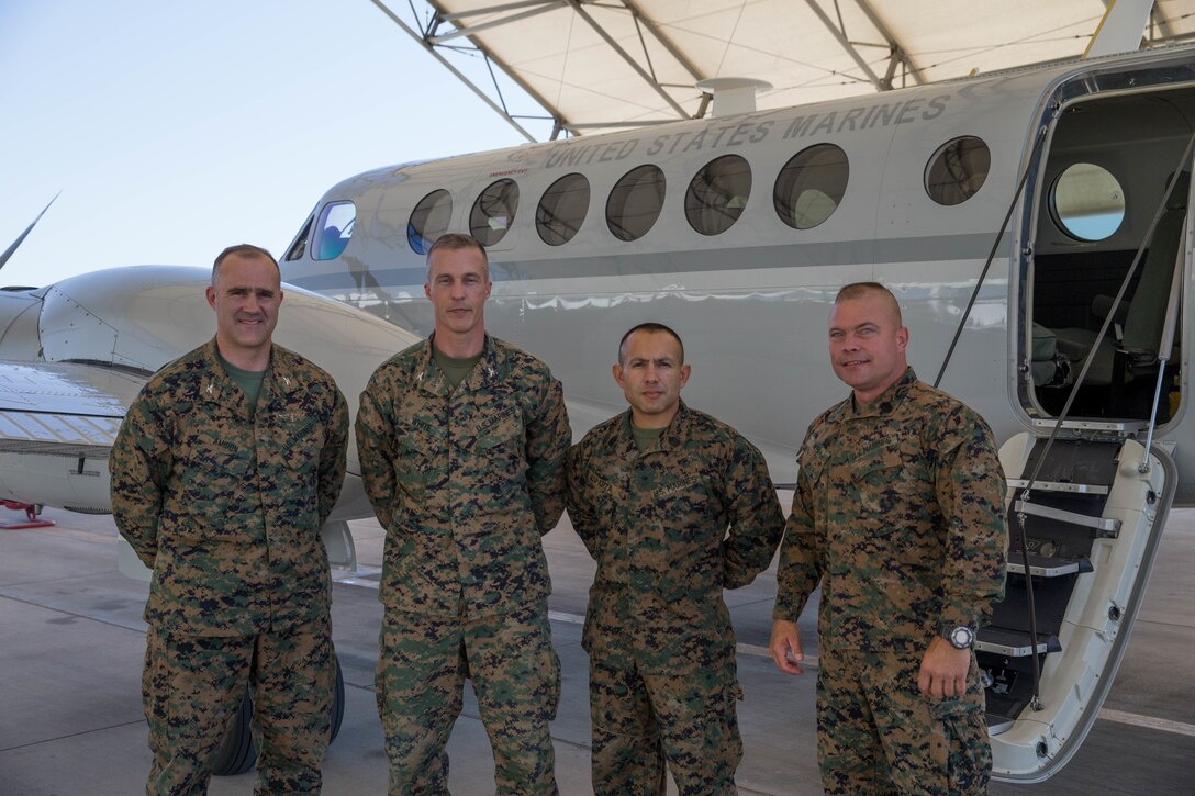 Col. Matthew F. Amidon (left), deputy group commander of Marine Aircraft Group 41, 4th Marine Aircraft Wing, Col. Steven J. White (left-center), commanding officer of 23rd Marine Regiment, 4th Marine Division, Sgt. Maj. Ruben Anthony Esparza (right-center), sergeant major of 23rd Marines, 4th MarDiv, and Sgt. Maj. Dallas K. Neel (left), sergeant major of MAG-41, 4th MAW, pose by a U.S. Marine Corps C-12 for a group photo during Integrated Training Exercise 4-18 in El Centro, California, on June 9, 2018. Marine Aircraft Group 41 is fulfilling the Air Combat Element role of ITX 4-18, providing essential support to Ground Combat Elements of Marine Air Ground Task Force 23. (Photo by U.S. Marine Corps Lance Cpl. Samantha Schwoch/released)