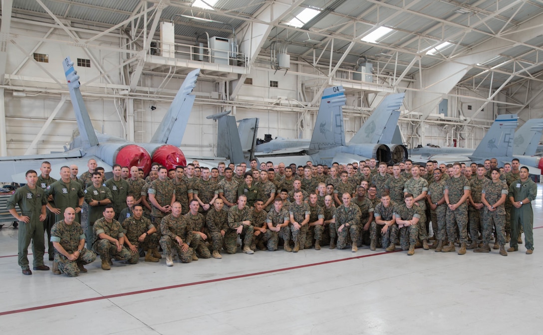 Senior leaders with 23rd Marine Regiment, 4th Marine Division, and Marine Aircraft Group-41, 4th Marine Aircraft Wing, pose for a photo with Marine Fighter Attack Squadron 112, MAG-41, 4th MAW, during Integrated Training Exercise 4-18 in El Centro, California, on June 9, 2018. Marine Aircraft Group 41 is fulfilling the Air Combat Element role of ITX 4-18, providing essential support to Ground Combat Elements of Marine Air Ground Task Force 23. (Photo by U.S. Marine Corps Lance Cpl. Samantha Schwoch/released)