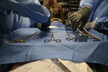Navy surgeons with 3rd Medical Battalion, 3rd Marine Logistics Group conduct a simulated surgery at Kin Blue, Okinawa, Japan, June 6, 2018. The simulation is part of Exercise Inochi No Onjin, which increased interoperability between joint services on en-route care by conducting a multitude of patient evacuations.  3rd Med. Bn. is responsible for providing general and direct health service support to III Marine Expeditionary Force. (U.S. Marine Corps photo by Lance Cpl. Harrison Rakhshani)