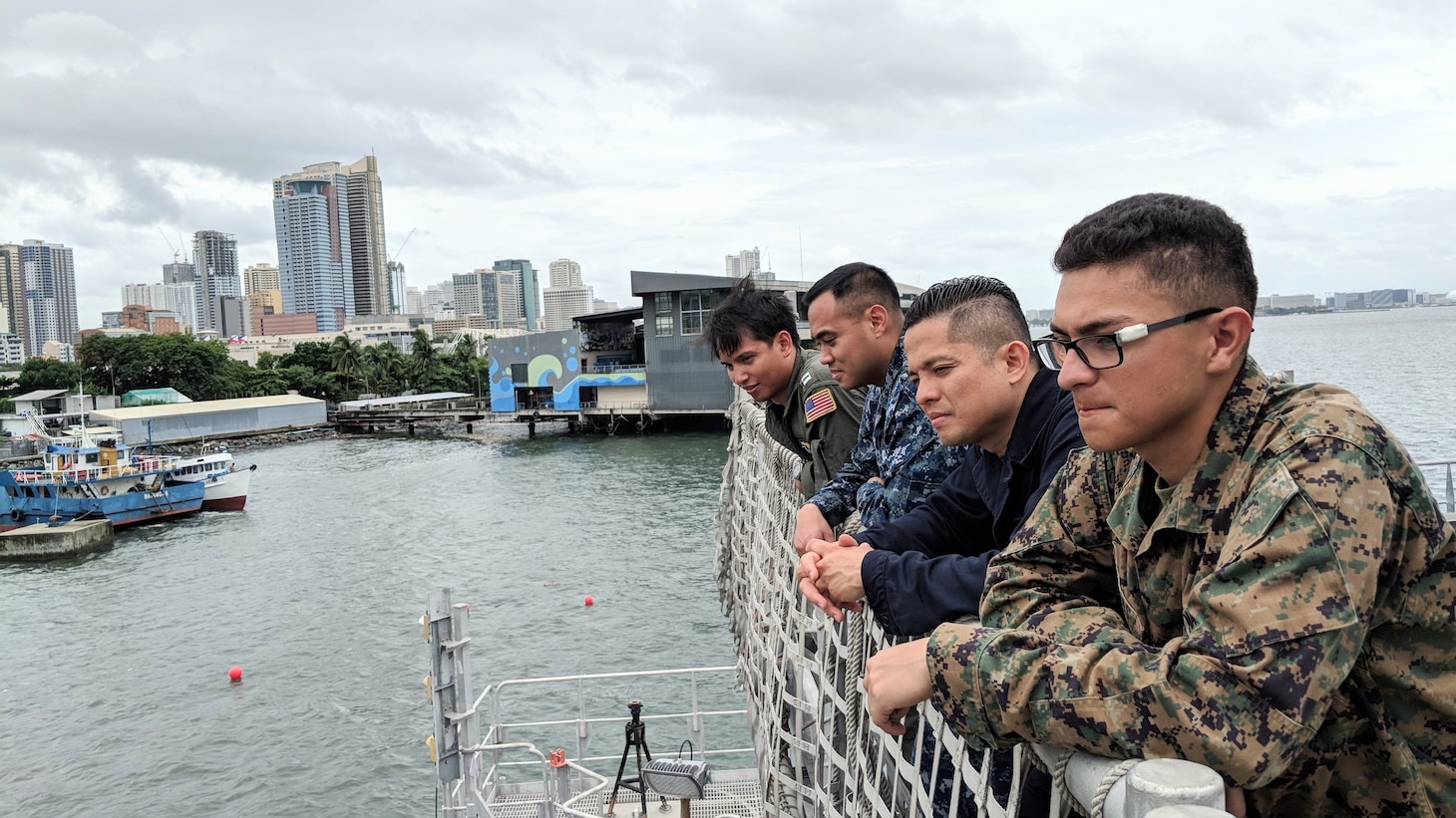 MANILA, Republic of the Philippines (June 11, 2018), Lance Cpl. Erwin Matias, Lt. Ivin Dysangco, Chief Religious Programs Specialist Nino Miranda, Information Systems Technician 1st Class Reiner Ramos, Hospital Corpsman 1st Class Ed Ibay, all from the Republic of the Philippines, pose for a group photo as USNS Millinocket (T-EPF 3) pulls into the port of Manila. More than 40 members of the U.S. 7th Fleet staff are currently embarked on Millinocket, visiting several countries in the Indo-Pacific in support of a theater security cooperation patrol.