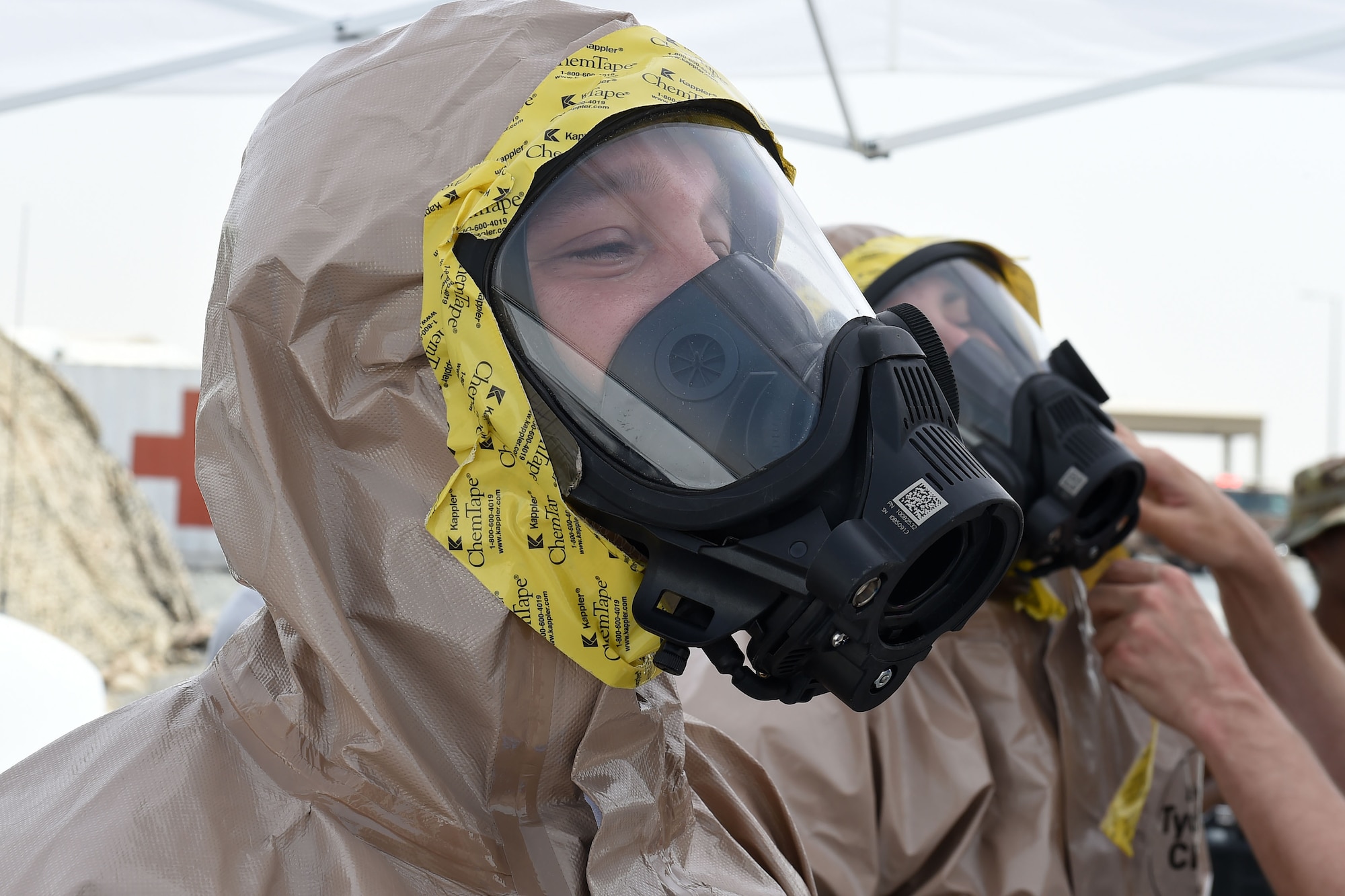 Airman puts on protective mask